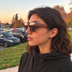 Woman wearing BRUME tea fit-over sunglasses at sunset