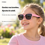 Lunettes de soleil PETIT NORD rose pour enfant portées par-dessus des lunettes de vue